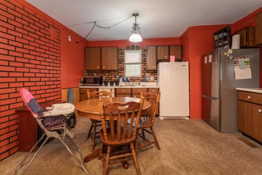 Combined dining and kitchen. Gas hookup behind freezer if you want gas appliances