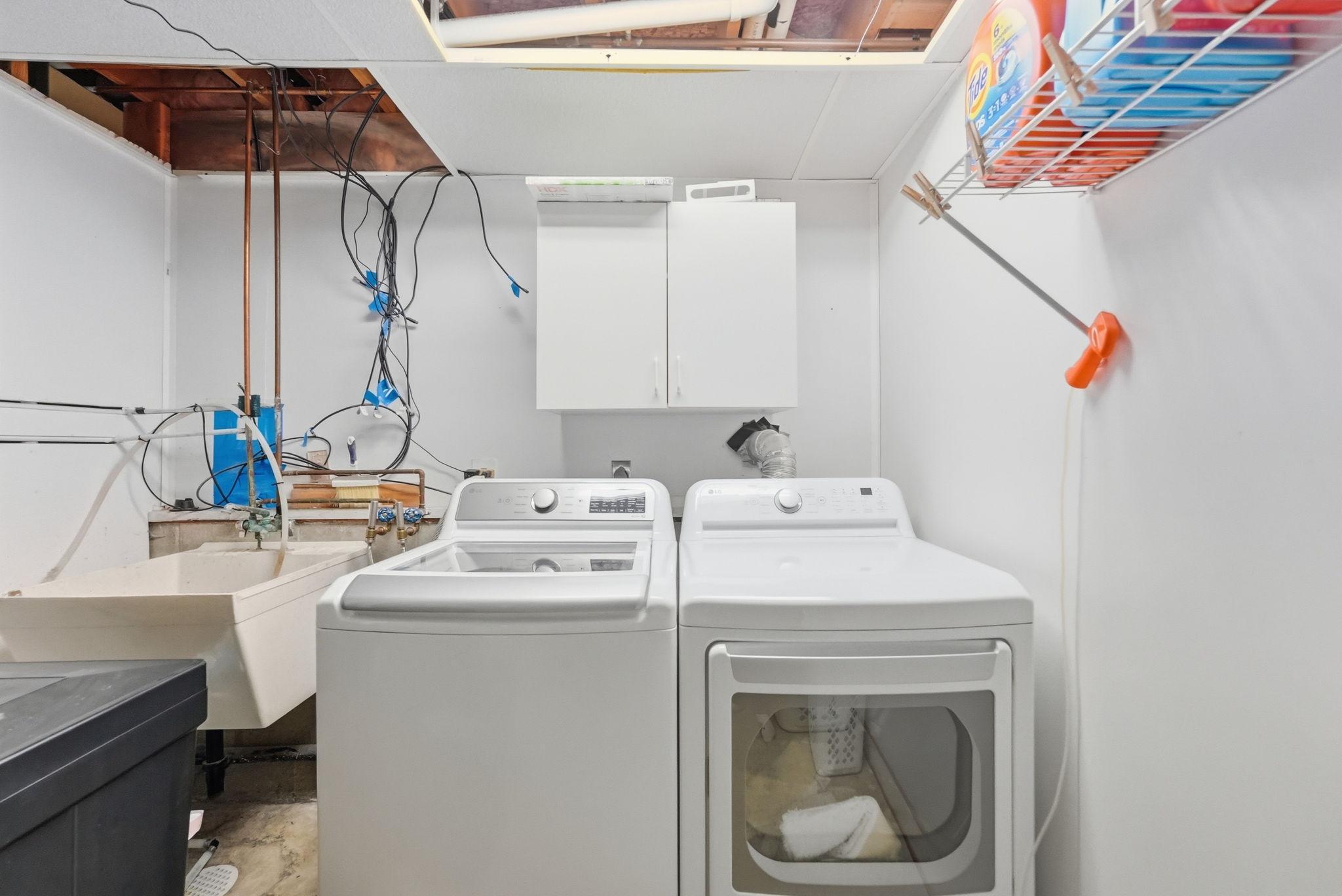 Laundry room with a utility sink.