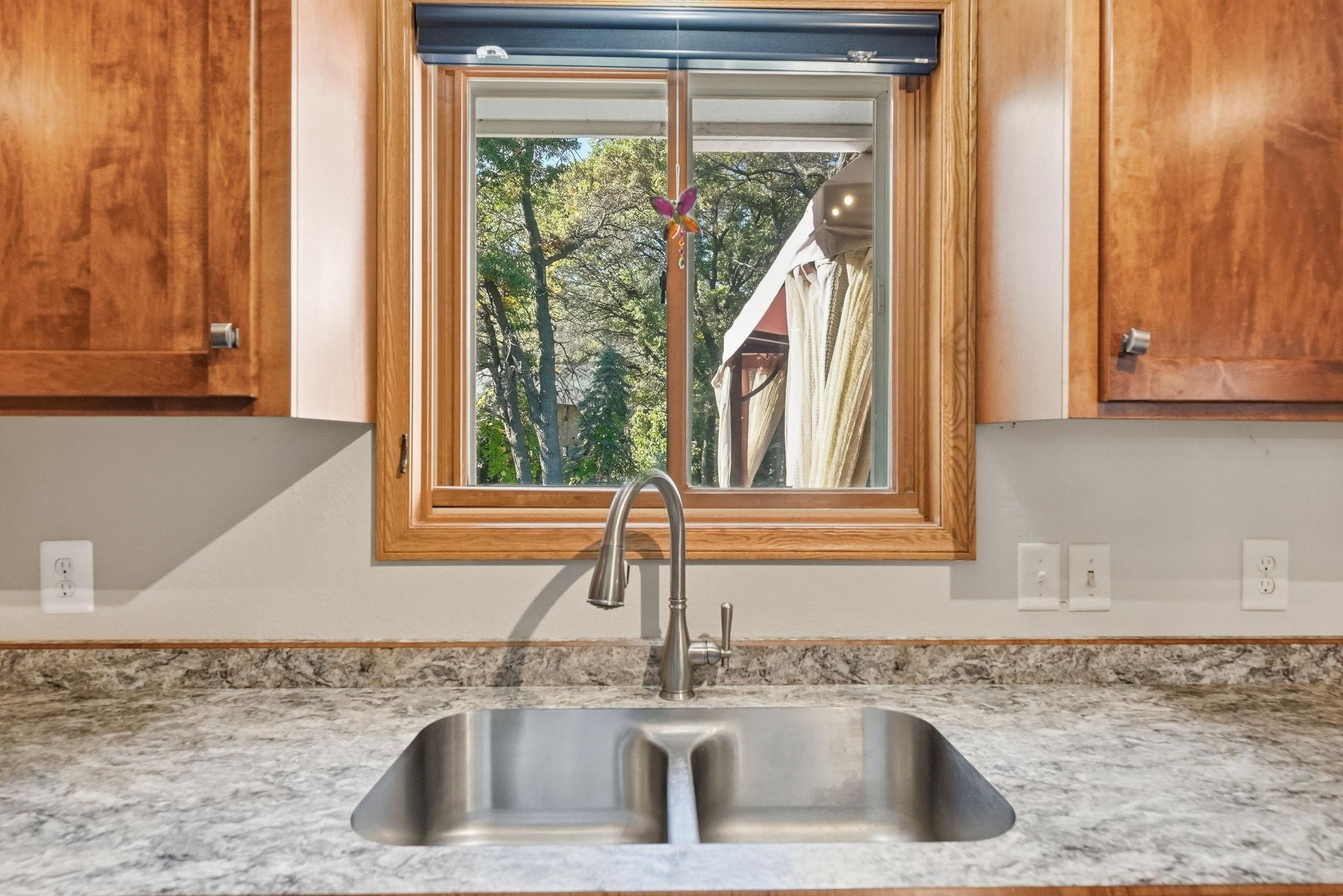 Kitchen windows allows natural light to open up this area.