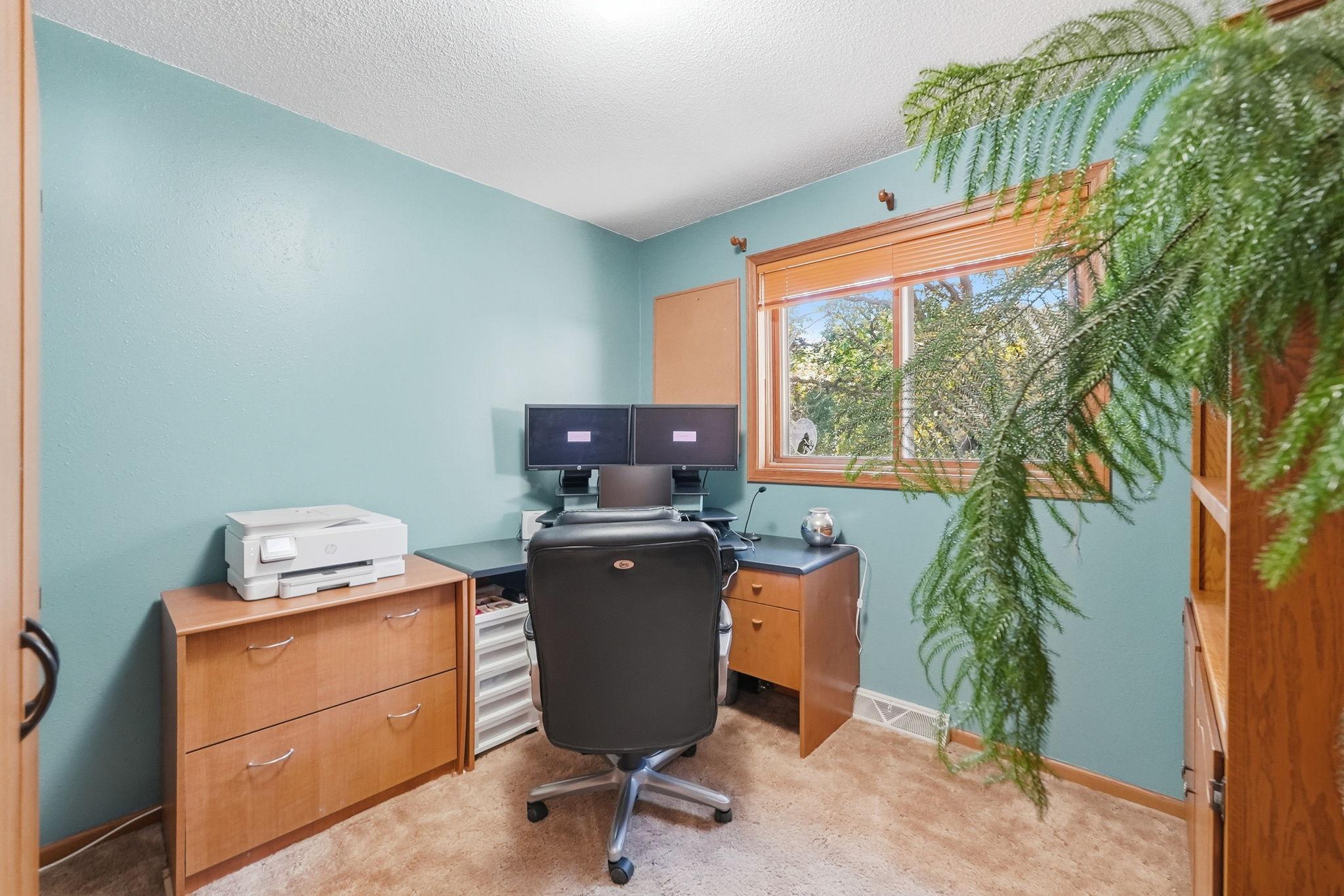 Upper level bedroom currently being used as an office.