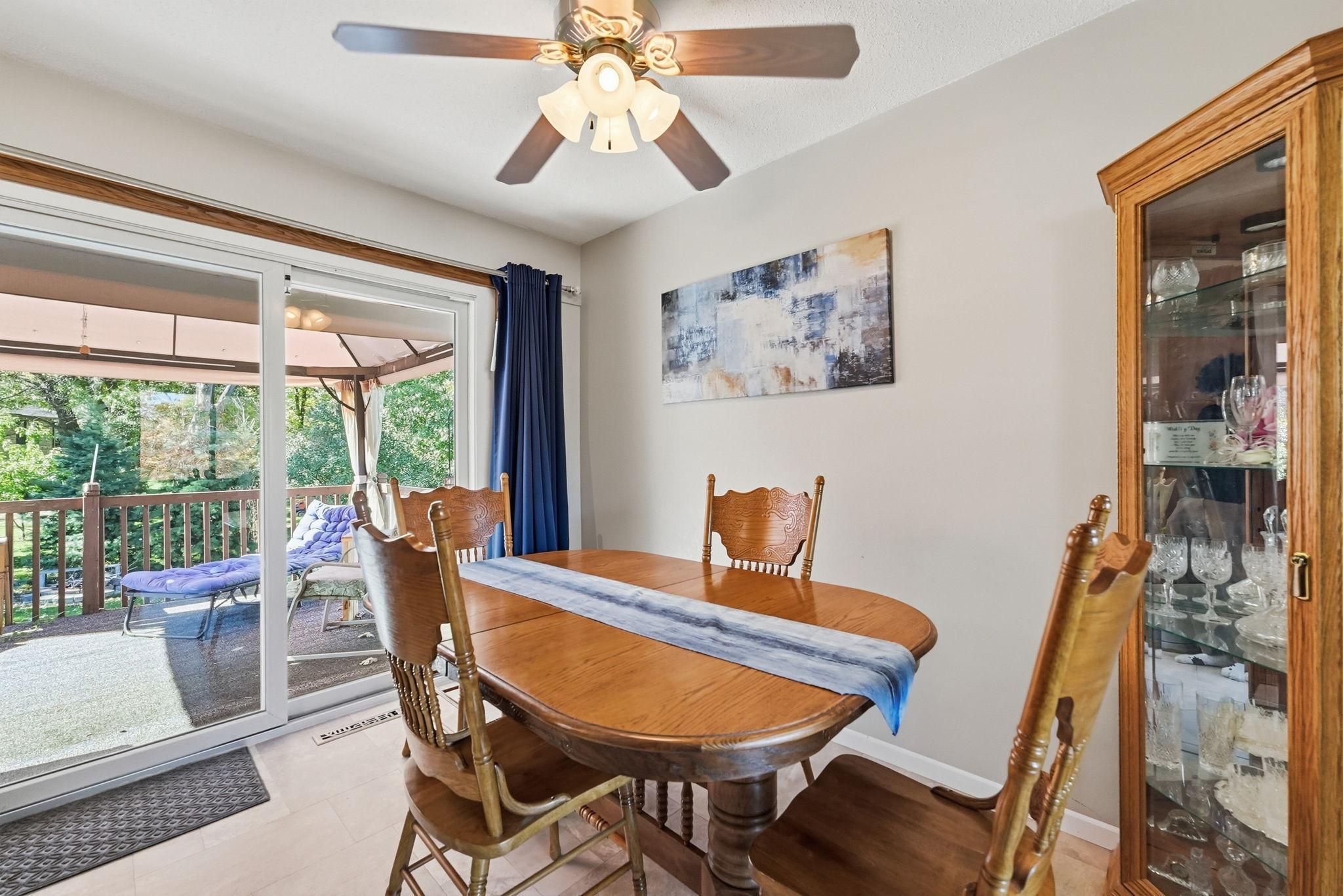 Dining room lends access to to the back deck.