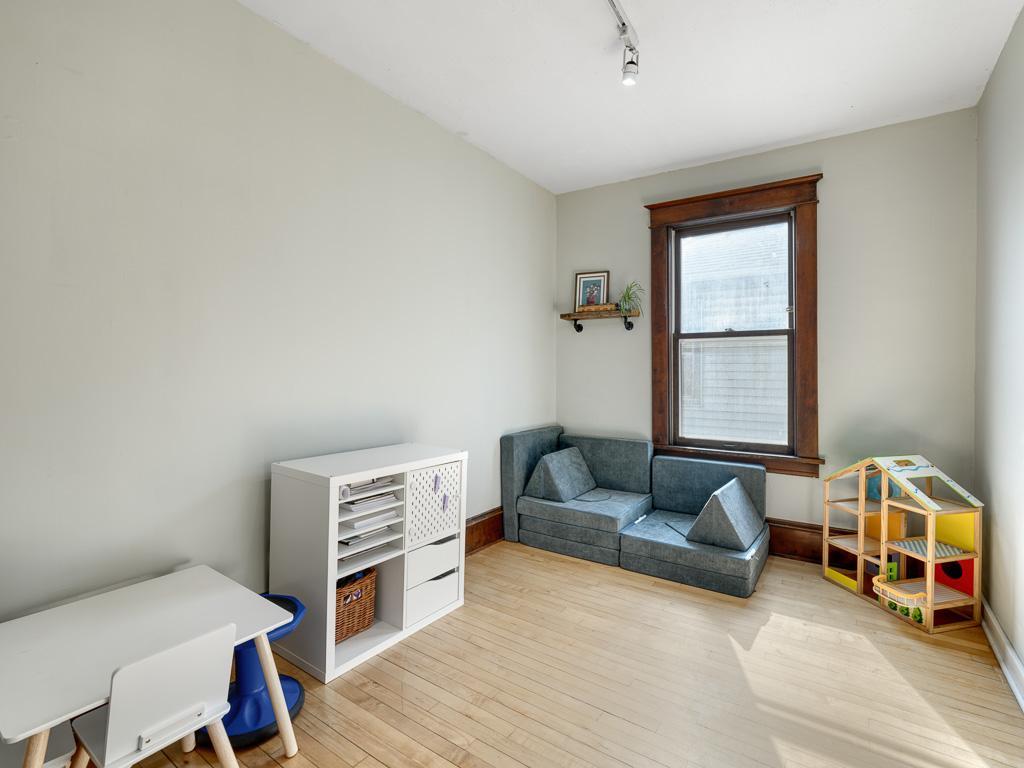 The main floor bedroom doubles as a playroom.