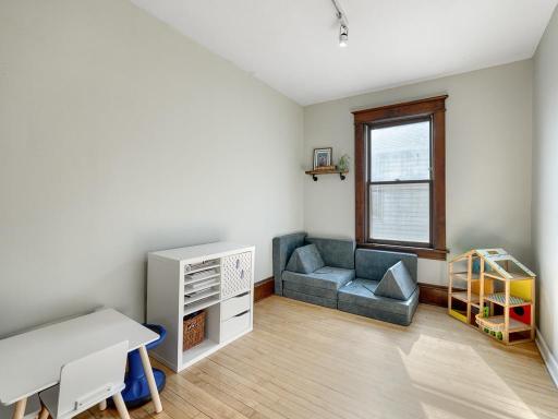 The main floor bedroom doubles as a playroom.