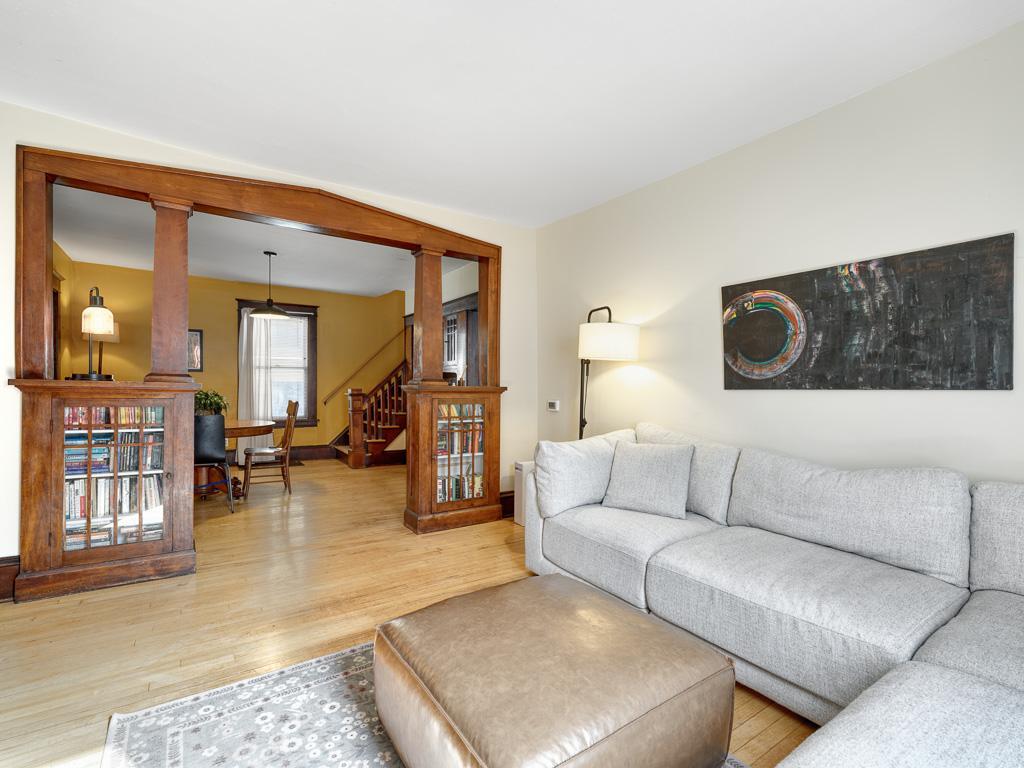 Beautiful built-in bookshelves add timeless charm and character to the home, flowing seamlessly into the spacious dining area.