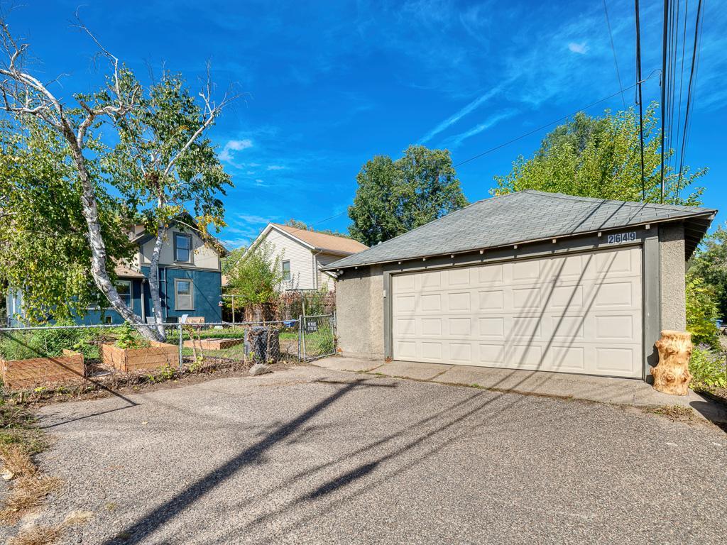 There is an oversized double garage with great space off the alley for parking in or outside the garage.