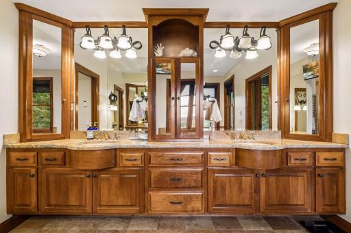 Handcrafted cherry cabinetry and warm granite give this dual vanity both function and furniture-quality style