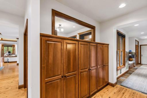 Custom cabinetry storage options abound throughout the home