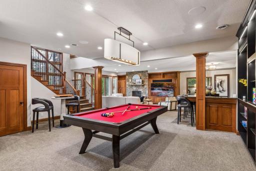 Entertainment-ready rec room with wet bar, billiards area and room to gather