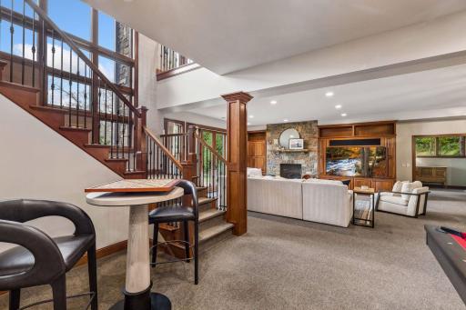 Entertainment-ready rec room with wet bar, billiards area and room to gather