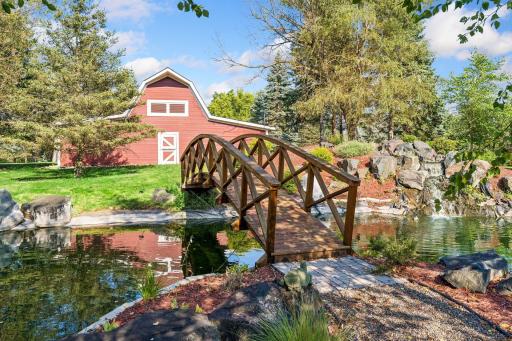 Arched footbridge leading toward the Civil War era barn