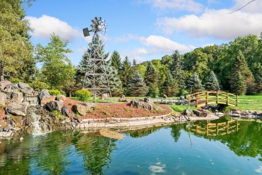 Your own park-like retreat: pond with waterfall, windmill and arched wooden footbridge