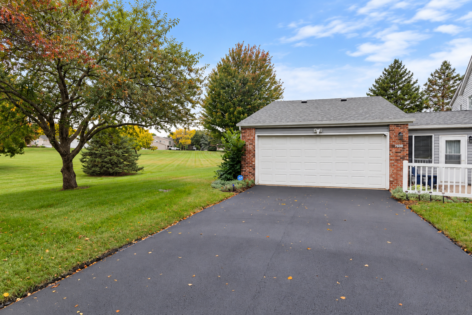 Driveways were just seal coated September 29th. This angle shows your side yard as this home is the end-unit which is an added bonus.