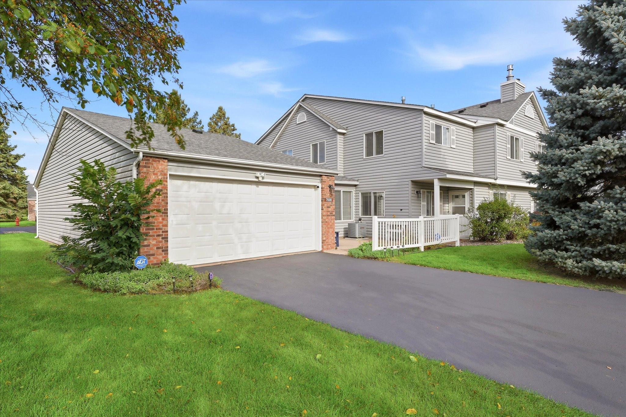 Beautiful curb appeal at your new home! Bonus end-unit with a front seating area. Driveways were just seal coated in September 2026.