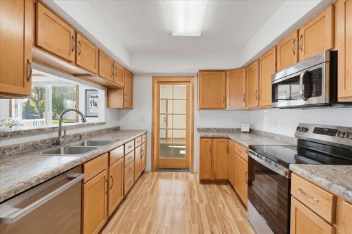 Another angle with a closed door if desired. A surplus of countertop and cabinet space.