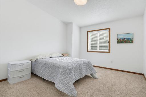 Primary bedroom on the upper level that has a walk-in closet.