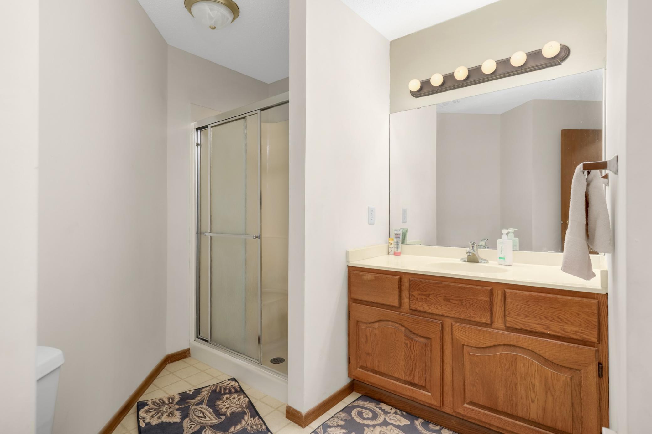 3/4 bathroom featuring a walk-in shower for easy everyday use.