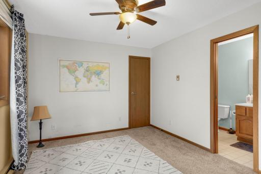 Spacious second bedroom featuring a generous walk-in closet and convenient access to the second bathroom.