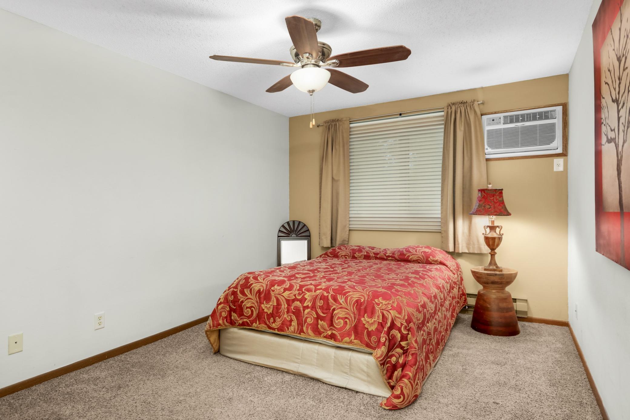 A spacious primary bedroom with plenty of room to relax and unwind.