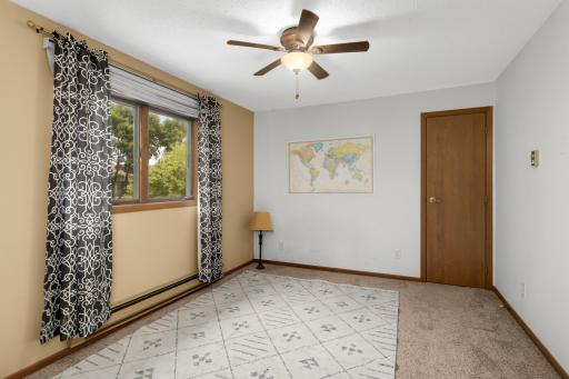 A versatile space that could easily serve as a guest bedroom, home office, or workout space.