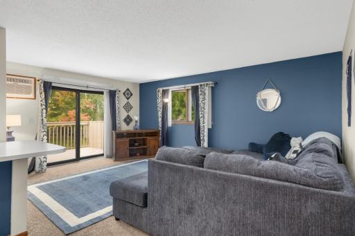 A gorgeous accent wall adds a beautiful pop of color to the living room.