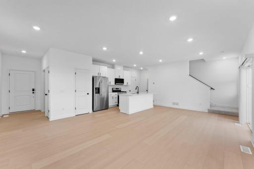A convenient breakfast bar provides simple entertaining off the dining area
