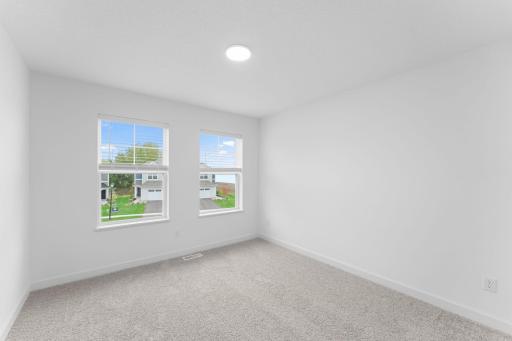 Situated down the hallway from the ownerâs suite are two secondary bedrooms. Both include practical closet space and plush wall-to-wall carpeting.