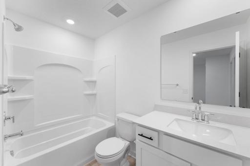 An optional third bathroom provides convenience to the basement level