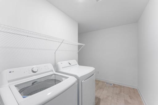 This spacious laundry room is located on the same level as the bedrooms in a thoughtful design to get weekly chores done in a snap.
