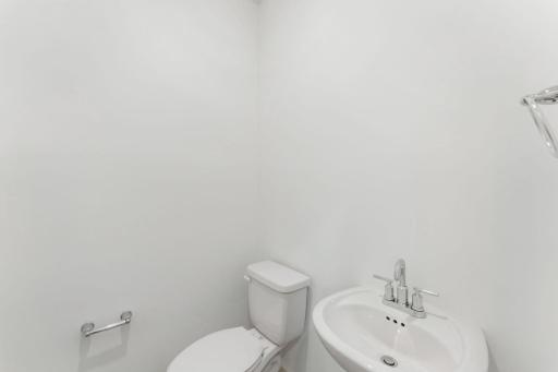 Right off the foyer is a convenient powder room to accommodate the needs of the whole family and visiting guests alike.