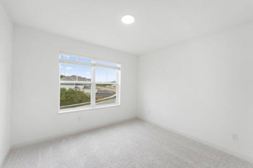 Situated down the hallway from the ownerâs suite are two secondary bedrooms. Both include practical closet space and plush wall-to-wall carpeting.