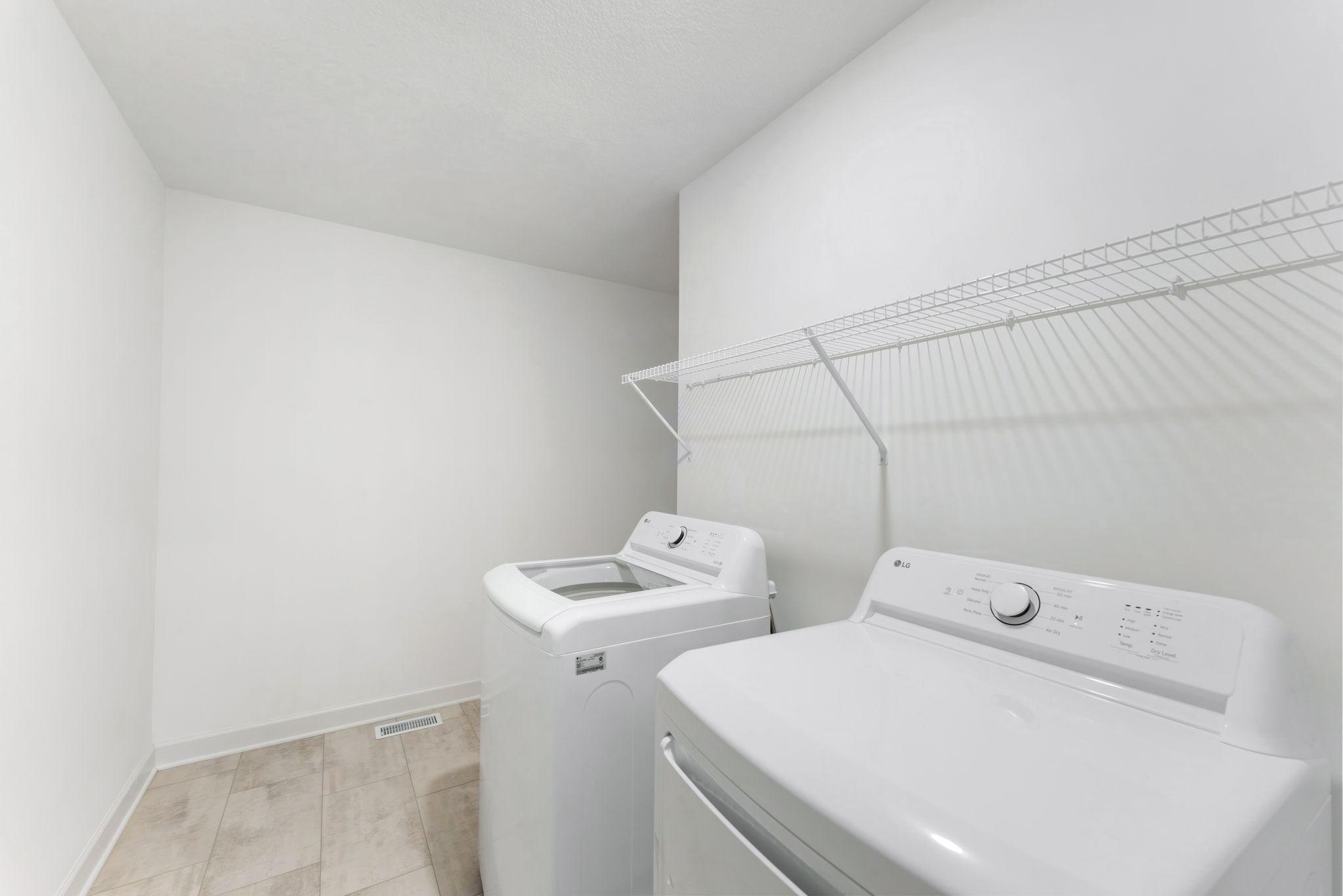 This spacious laundry room is located on the same level as the bedrooms in a thoughtful design to get weekly chores done in a snap.