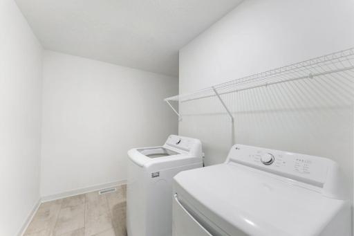 This spacious laundry room is located on the same level as the bedrooms in a thoughtful design to get weekly chores done in a snap.