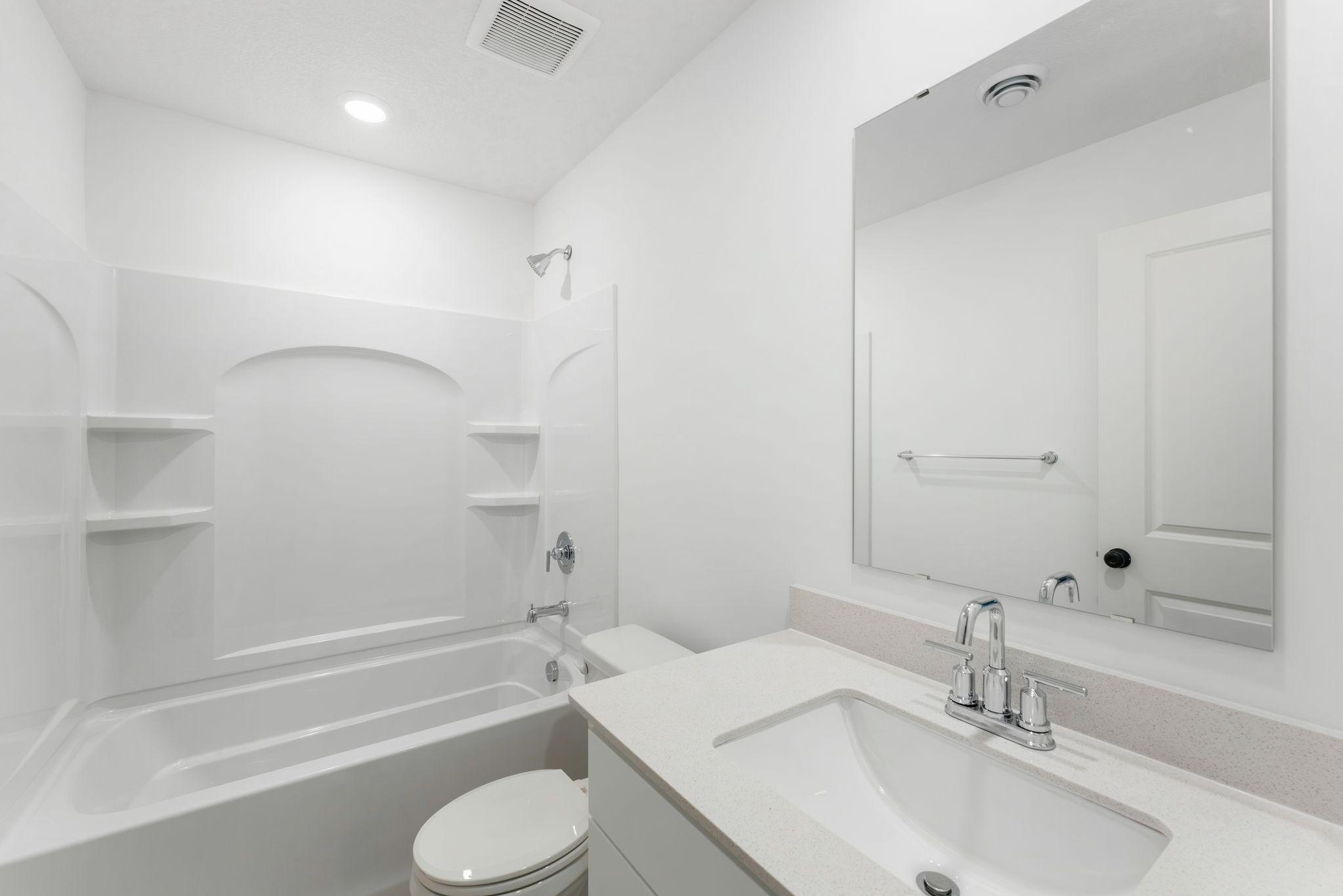 An optional third bathroom provides convenience to the basement level