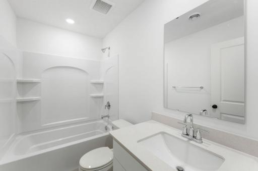 An optional third bathroom provides convenience to the basement level