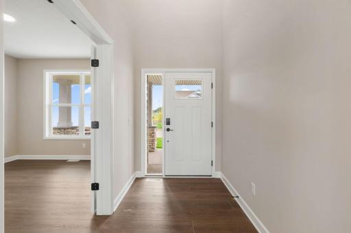 Luxury vinyl plank flooring runs throughout the main living areas of the home to create a cohesive look