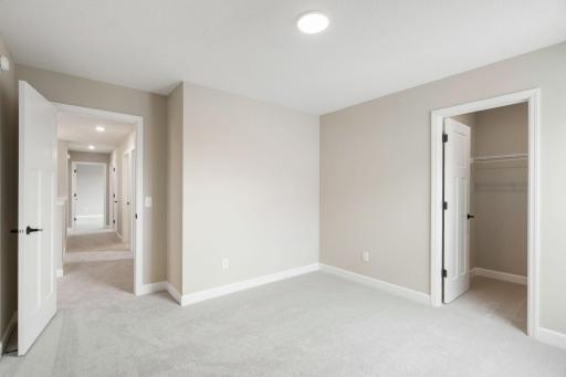 There are three secondary bedrooms on the second floor, offering household members privacy and space to rest.