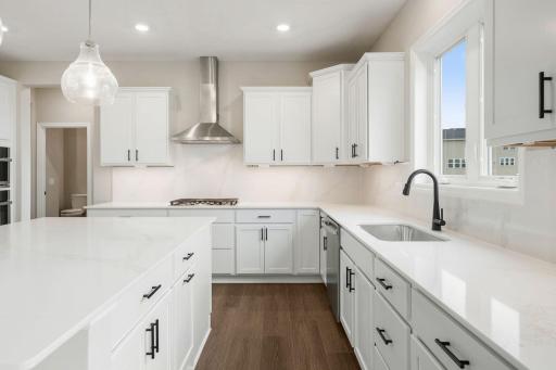 Designer-selected cabinetry keeps everything within reach and out of sight at the same time