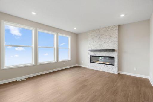 A wall of large windows in the Great Room offer a sunlit view of the neighborhood and brighten daytime gatherings. Itâs an ideal space for relaxing and enjoying the company of loved ones.