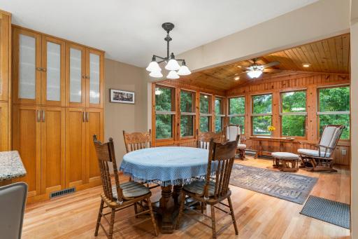 The dining area has plenty of space for a larger table. Notice the great views from the porch.