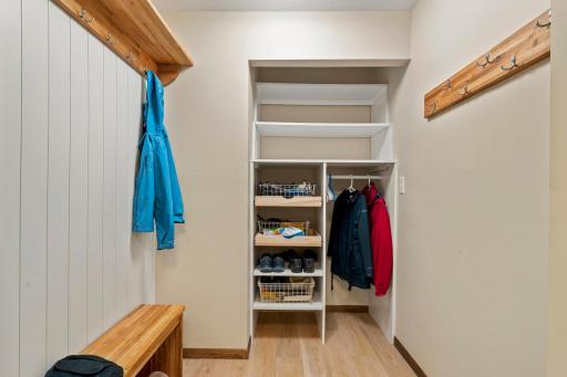Great open closet shelving for coats and storage.