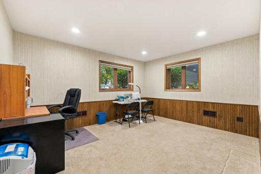Lower-level bedroom #4 is currently being used as an office/sewingroom. Notice that this room has recessed lighting and two windows.