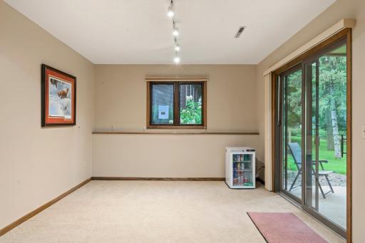 Extra room off the family room could be used as a game room. The lower level walks out onto a concrete patio to the backyard
