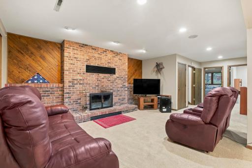 The fireplace has a Kozy Heat insert with a blower and has been maintained yearly. There are also built-in speakers in this room and the living room.