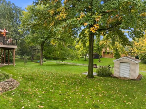 The backyard has mature trees and a walking path to the elementary, middle, and high school. The property also has invisible fencing for a dog.