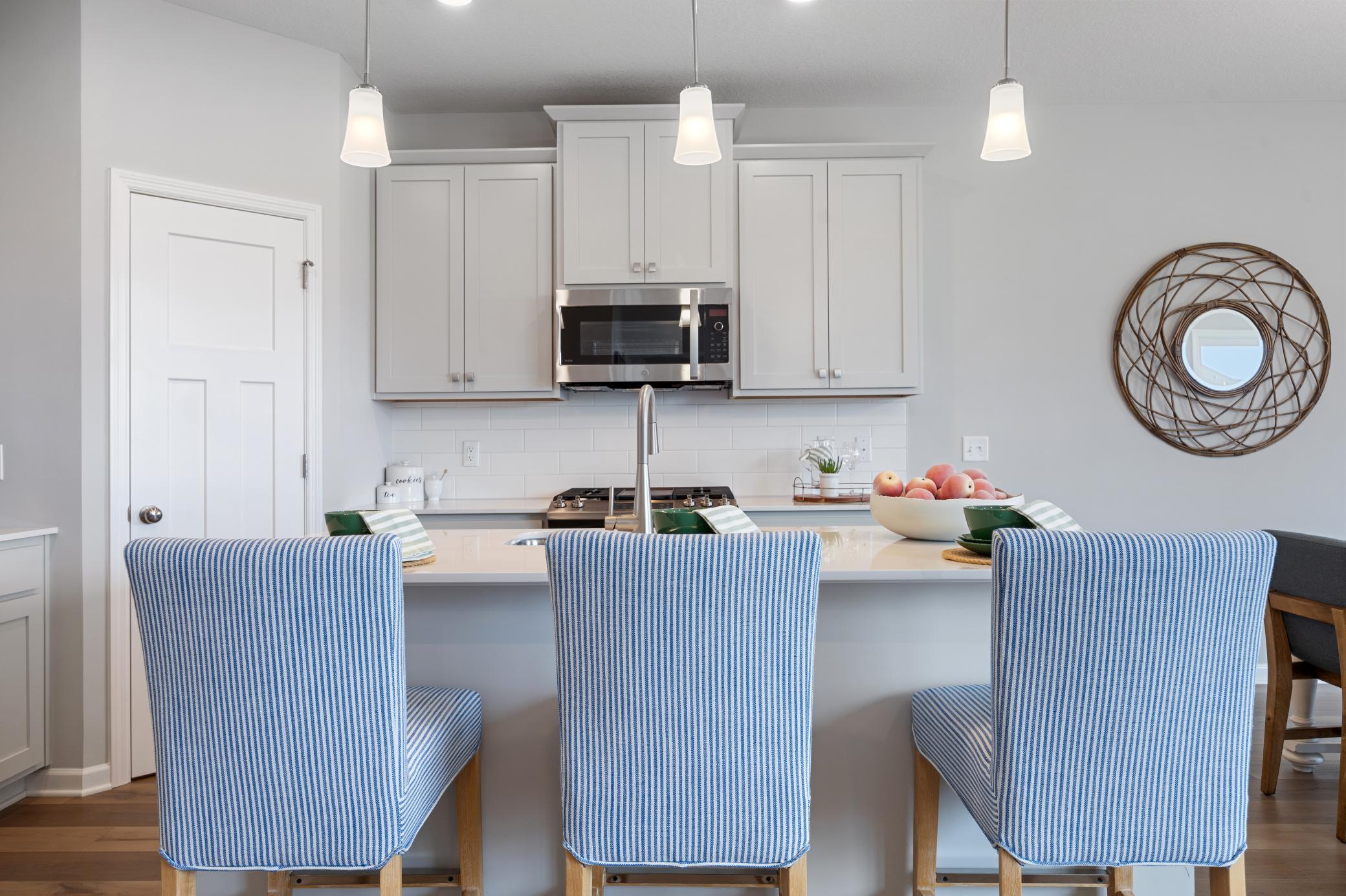 The center island will be a great place to gather for conversations. *Model home photos, many options to choose on this to be built home.*