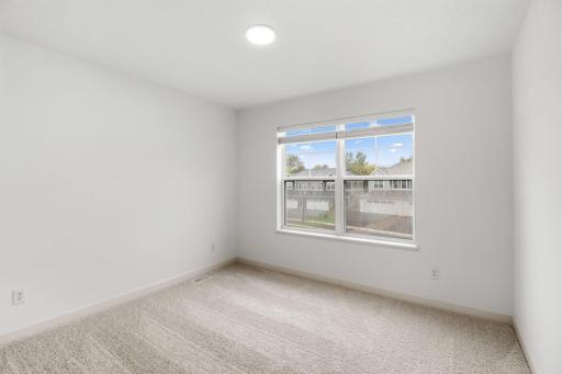 Situated down the hallway from the ownerâs suite are two secondary bedrooms. Both include practical closet space and plush wall-to-wall carpeting.