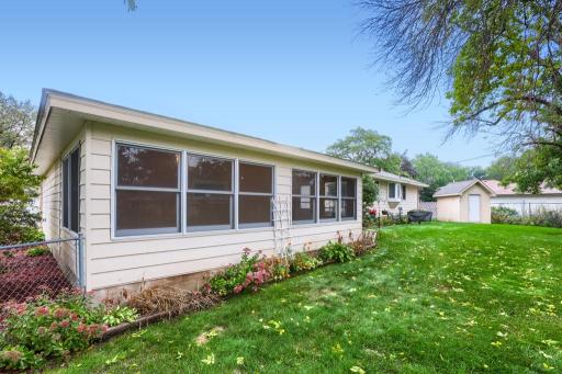 Enjoy sitting in your 3 Season Porch off of the garage. Great space to read, craft, host family & friends, or watch your favorite show. Backyard has plenty of perennials and a fenced yard for the pets.