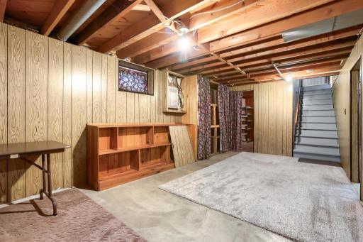 Lower level open space area. 200 AMP panel. Updated vinyl lookout windows.