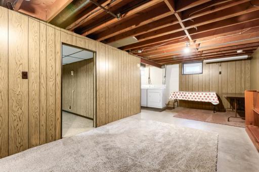 Lower level rec room, laundry and craft room. Add your finishing touches for more finished square footage.