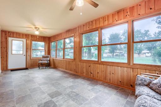 3 Season Porch attached the back side of the garage. Add electric heat for year round enjoyment. Views of the backyard. Or could be used as a workshop area too.